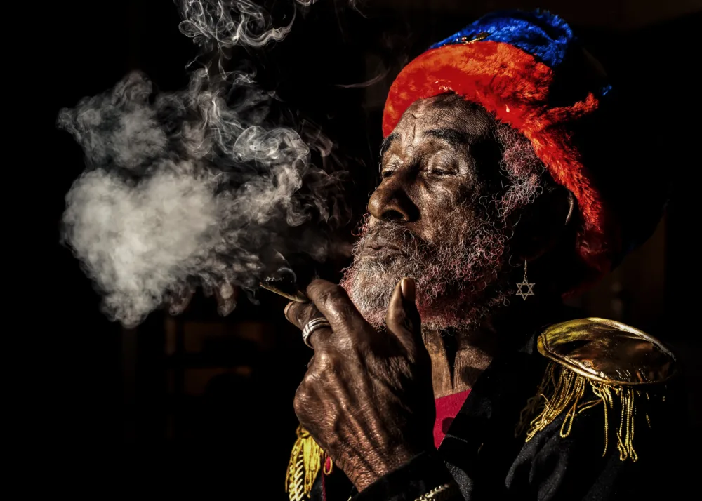 Lee Scratch Perry was a Jamaican music producer and singer-songwriter, born on March 20, 1936, and passed away on August 29, 2021. He was considered one of the pioneers of the reggae and dub genres, and played a major role in shaping the sound of Jamaican music in the 1960s and 1970s. Perry worked with numerous artists during his career, including Bob Marley and the Wailers, The Congos, and Junior Murvin, among others. He also produced some of his own albums, such as 
