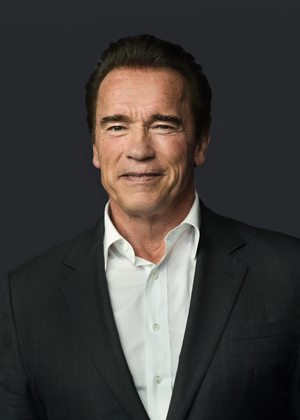 Arnold Schwarzenegger is an Austrian-American actor, filmmaker, businessman, and former professional bodybuilder. Born on July 30, 1947, in Thal, Austria, Schwarzenegger rose to fame in the 1970s and 1980s as a bodybuilder, winning numerous competitions including Mr. Olympia seven times. Schwarzenegger's success in bodybuilding led to a career in Hollywood, where he starred in a number of blockbuster action films, including The Terminator series, Predator, and Total Recall. He is also known for his roles in comedies like Twins and Kindergarten Cop. In addition to his film career, Schwarzenegger has been active in politics, serving as the Governor of California from 2003 to 2011. He has also been a philanthropist, supporting a variety of causes including after-school programs, health initiatives, and environmental conservation efforts. With his iconic physique, distinctive accent, and larger-than-life personality, Schwarzenegger has become a cultural icon, known for his achievements in both the entertainment industry and the world of sports, as well as his dedication to public service and philanthropy.